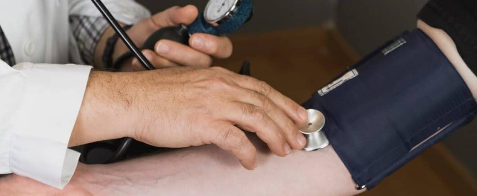 doctor-checking-blood-pressure_23-2147612162