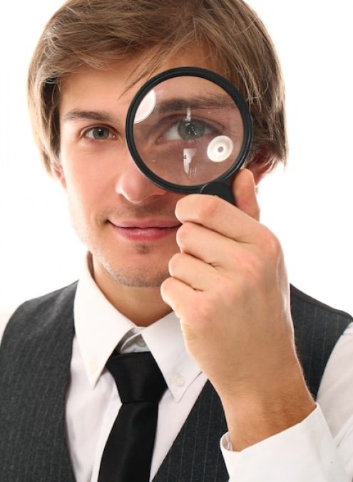 portrait-young-man-with-magnifying_144627-21905